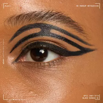 Close of a model wearing Epic Inky Stix on the top of their eyelid as a winged liner style in shade 01 Black Screen
