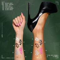 NYX Professional Makeup Party Animals SFX Face & Body Paint Sticks used to create white, brown and pink decorative designs on a model’s arms.