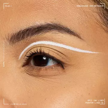 Close-up of an eye wearing NYX Professional Makeup Party Animals Epic Ink Liner in Phantom Lines as a crisp white graphic eyeliner design.