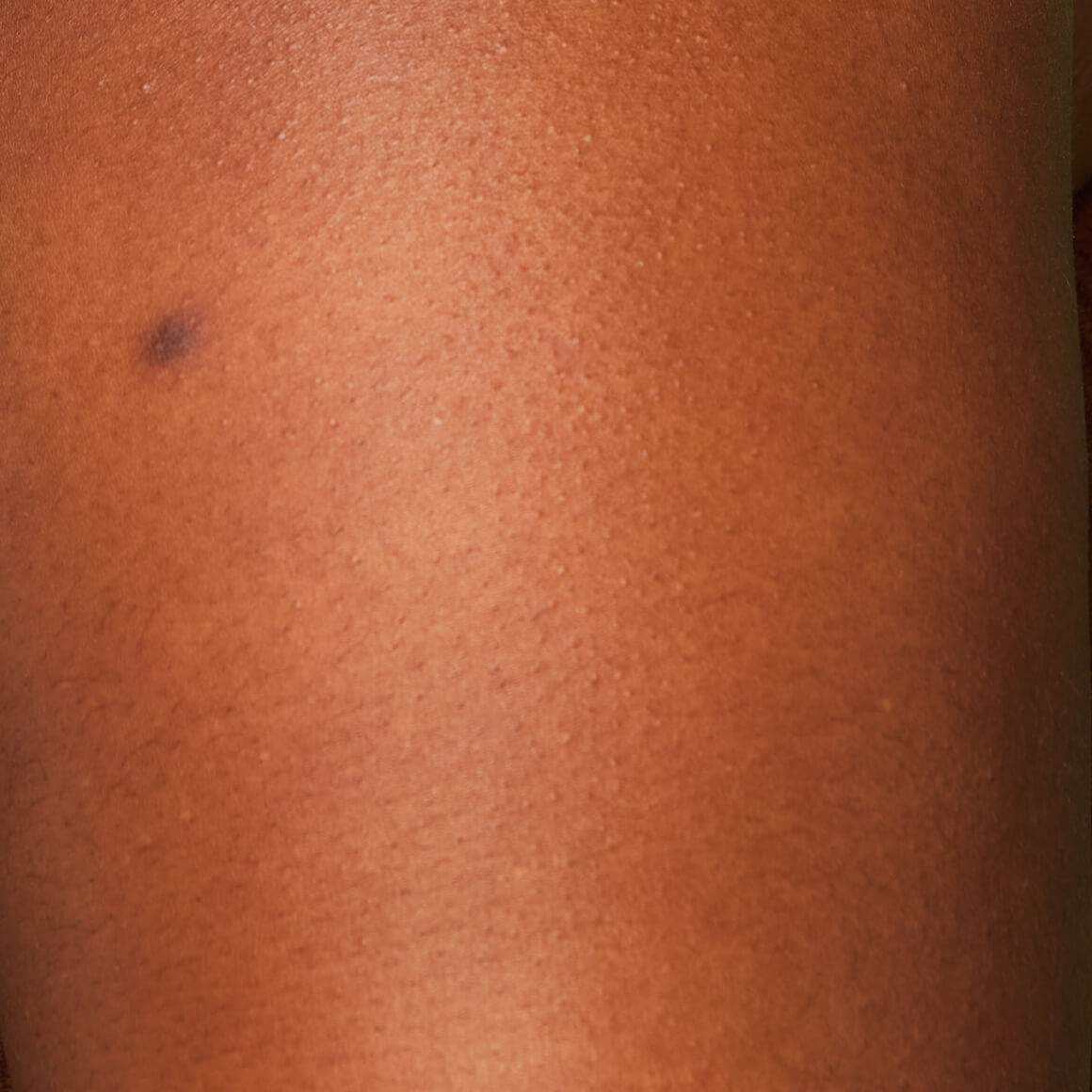 Image of the model’s arm before applying NYX Professional Makeup Caramelt Mami Body Butter.